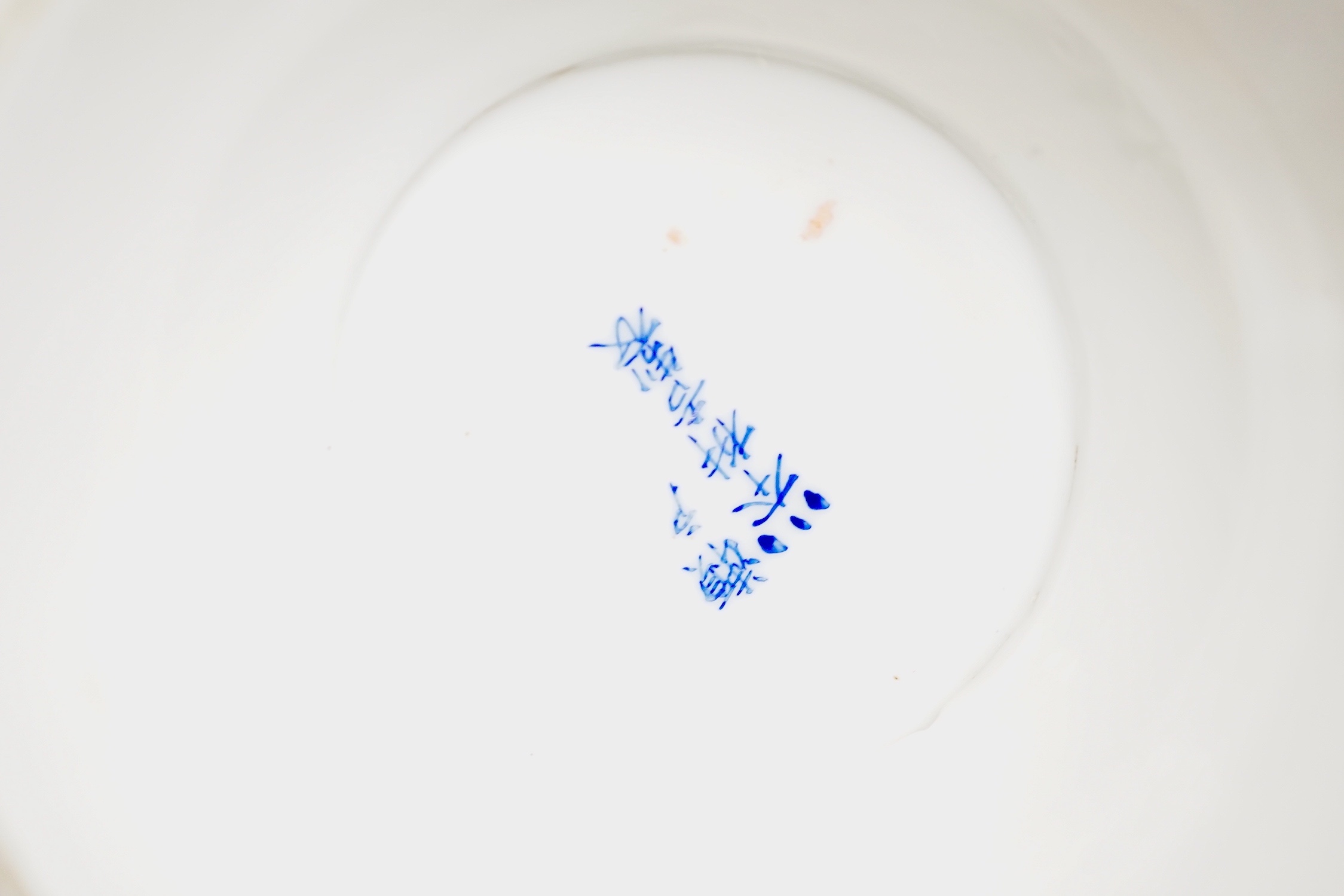 A group of 20th century Chinese and Japanese ceramics, including a blue and white circular plaque, 31 cm diameter